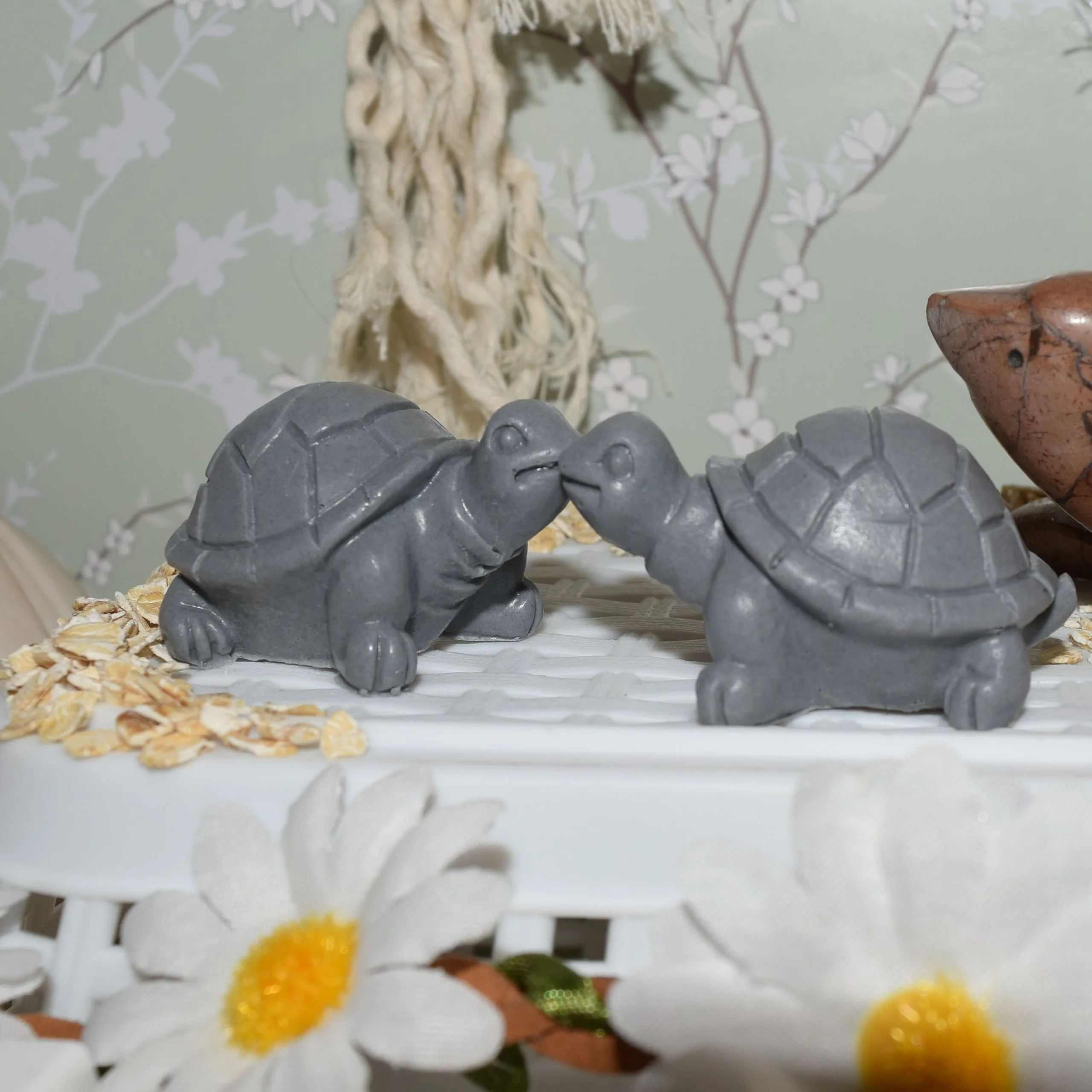 A pair of box turtle shaped soaps