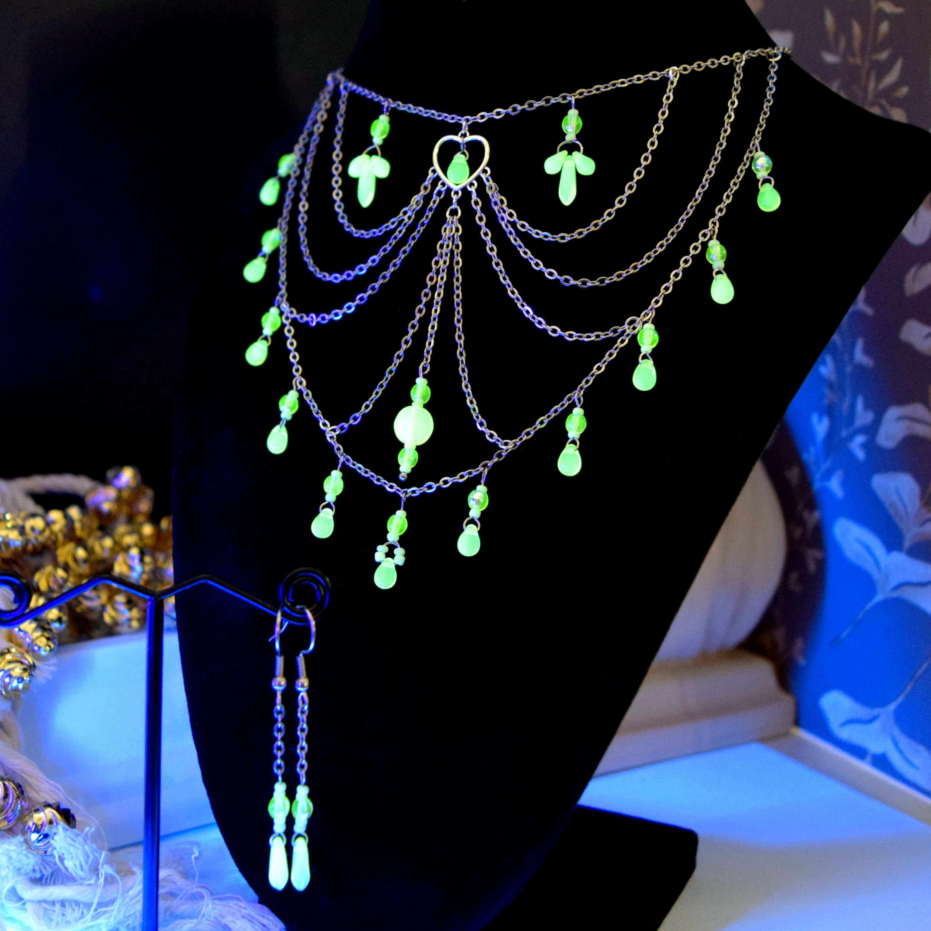 An intricate, glowing choker style necklace & earrings